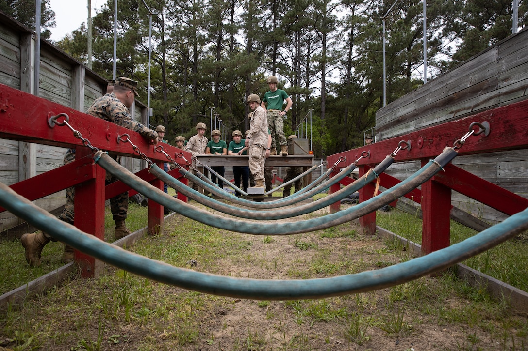 U.S. Marine Officer Candidates, with 6th Marine Corps District, discuss their approach while conducting a problem-solving event during a Mini - Officer Candidate School event at Marine Corps Recruit Depot Parris Island, South Carolina, April 1, 2023. Marine Officer Candidates from across the Southeastern United States attended this event to take part in training to help prepare them for Officer Candidate School. 

(U.S. Marine Corps photo by SSgt. Shannon Doherty)