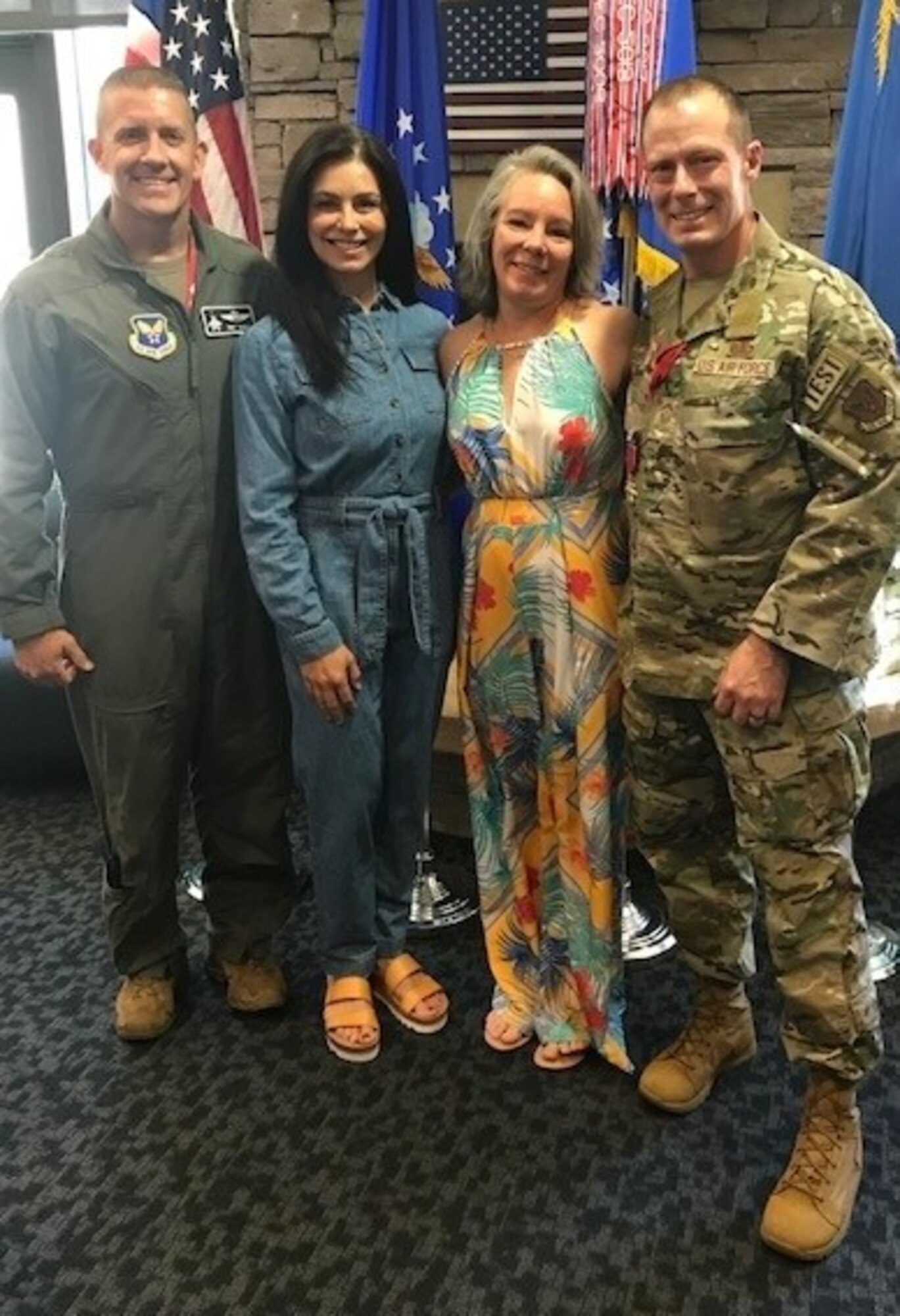 (Left to right) Air Force Operational Test and Evaluation Center Commander Maj. Gen. Trey Rawls, Scotta Rawls, Jamie Griste and AFOTEC Command CMSgt. Christopher Griste pose together during Chief Griste’s farewell party at Headquarters Air Force Operational Test and Evaluation Center April 14.