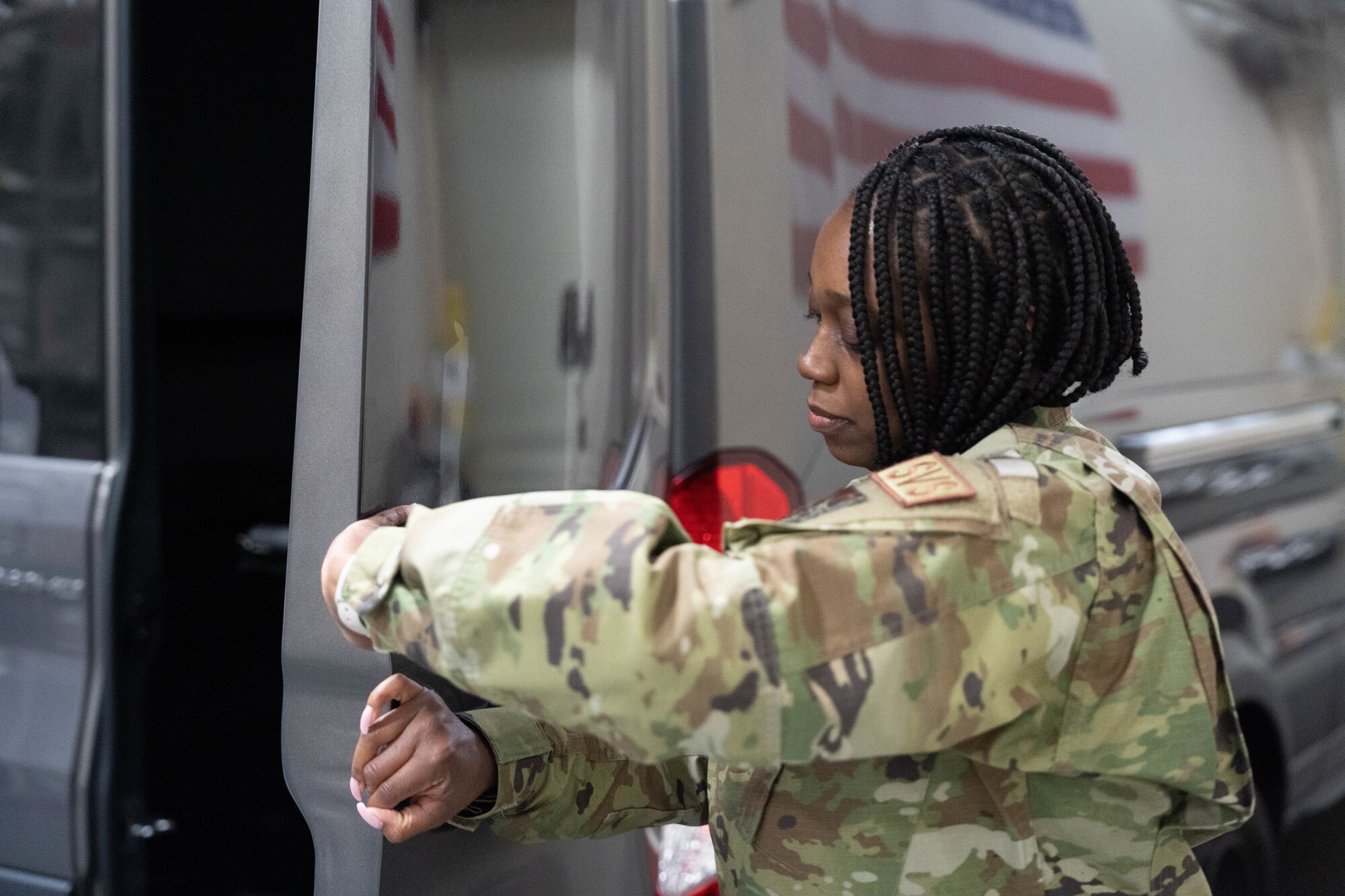 Senior Airman Alicia Davis, Force Support Contingency Training-Mortuary student at Air Force Mortuary Affairs Operations, practices door attendant duties at Dover Air Force Base, Delaware, April 20, 2023. FSCT-M students practice every facet of dignified transfers, including carries, door attendant duties and vehicle marshaling. Davis is assigned to the 514th Force Support Squadron, Joint Base McGuire-Dix-Lakehurst, New Jersey. (U.S. Air Force photo by Tech. Sgt. Katie Maricle)