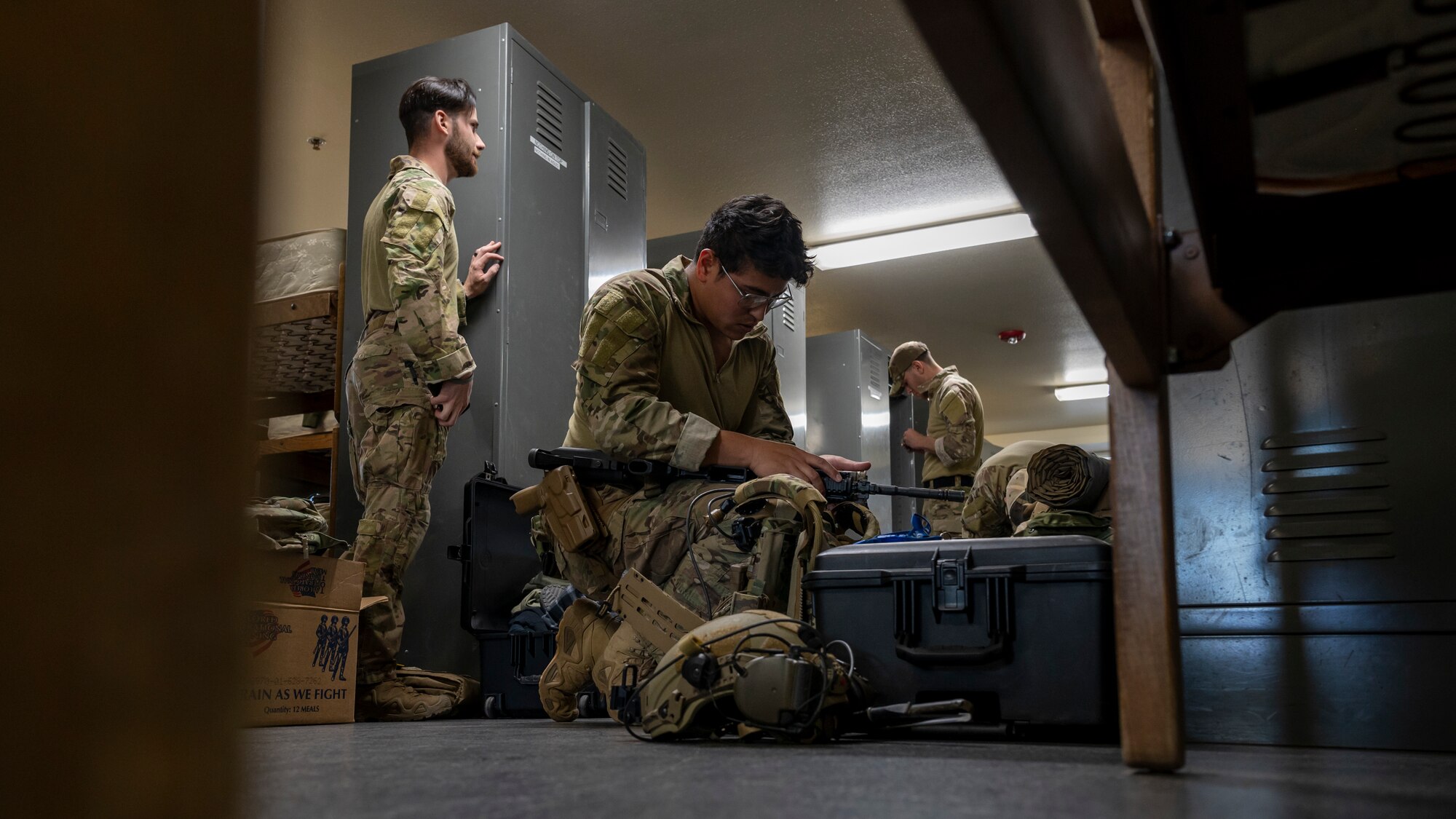 U.S. Air Force Senior Airman Nestor Guevara-Penella, 56th Civil Engineer Squadron Explosive Ordnance Disposal flight technician, assembles an M4 carbine assault rifle in a barracks bay at Camp Navajo, Arizona, April 10, 2023.