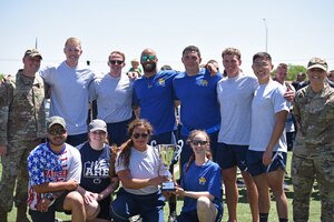 U.S. Air Force Col. Matthew Reilman, 17th Training Wing commander, and Chief Master Sgt. Rebecca Arbona, 17th TRW command chief, present the 315th Training Squadron with the winning trophy for Wing Sports Day on Goodfellow Air Force Base, April 21, 2023. Over 150 members participated in the wing-wide sports event. (U.S. Air Force photo by Senior Airman Ashley Thrash)