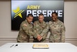 Brig. Gen. Kelly Dickerson (middle), deputy chief of staff, G3/5/7, Office of the Chief of the Army Reserve, prepares to cut the celebratory cake with a sword with the youngest and oldest Soldier at the Military Intelligence Readiness Command, the host of the 115th Army Reserve Birthday at Fort Belvoir, Virginia, April 20, 2023. (U.S. Army Reserve photo by Maj. Jeku Arce)