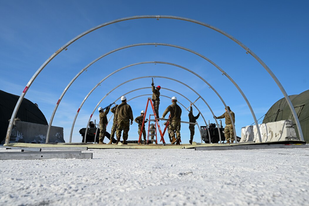 U.S. Airmen assigned to the 354th Fighter Wing set up a tent in preparation for exercise Arctic Gold 23-2 on Eielson Air Force Base, Alaska, April 14, 2023. Multi-Capable Airmen are trained outside their core Air Force specialties to provide support in an expeditionary deployed environment. (U.S. Air Force photo by Airman 1st Class Ricardo Sandoval)
