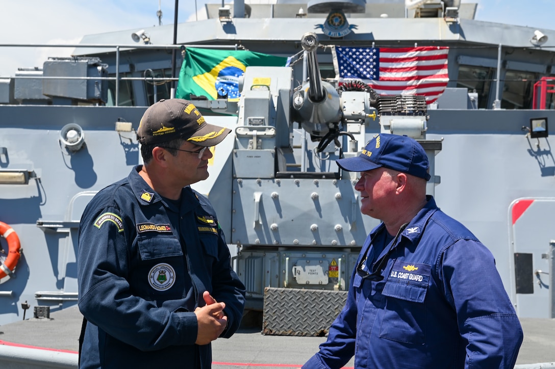 U.S. Coast Guard Capt. Clinton Carlson, right, USCGC Stone (WMSL 758) commanding officer, discusses ship capabilities with Brazil Navy Capt. Leonardo Gomes, Brazil Navy ship Amazonas commanding officer during an engagement aboard Amazonas in Rio de Janeiro, March 7, 2023. Stone is on a scheduled multi-mission deployment in the South Atlantic Ocean to counter illicit maritime activities and strengthen relationships for maritime sovereignty throughout the region. (U.S. Coast Guard photo by Petty Officer 3rd Class Riley Perkofski)