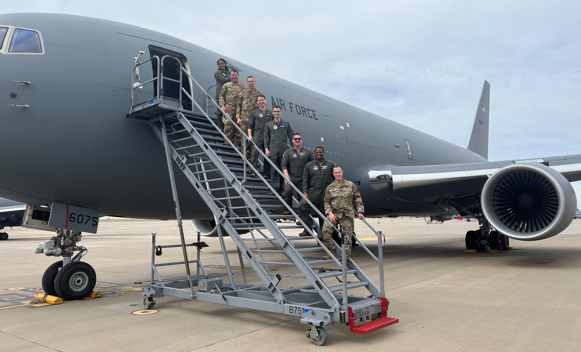 (Far right) CMSgt. Christopher Griste, Command Chief, Air Force Operational Test and Evaluation Center, visits McConnell AFB, Kan., to fly a mission on the KC-46A with McConnell’s 22nd Air Refueling Wing and AFOTEC Detachment 5’s lead test boom operator MSgt. Kyle Vanderwagen. The KC-46A is the first phase in recapitalizing the U.S. Air Force's aging tanker fleet. With greater refueling, cargo and aeromedical evacuation capabilities compared to the KC-135, the KC-46A will provide aerial refueling support to Air Force, Navy, Marine Corps and partner-nation receivers.