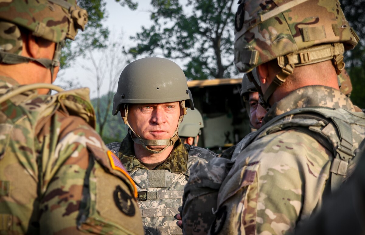 Lt. Gen. Bashkim Jashari, commander of the Kosovo Security Force, is briefed on unit operations by the commander of the 1st Battalion, 133rd Infantry Regiment, Iowa Army National Guard, during a tour of training at Camp Atterbury, Indiana, May 19, 2022. Approximately 15 KSF troops embedded with companies in the 1-133rd Infantry during a two-week annual training exercise.