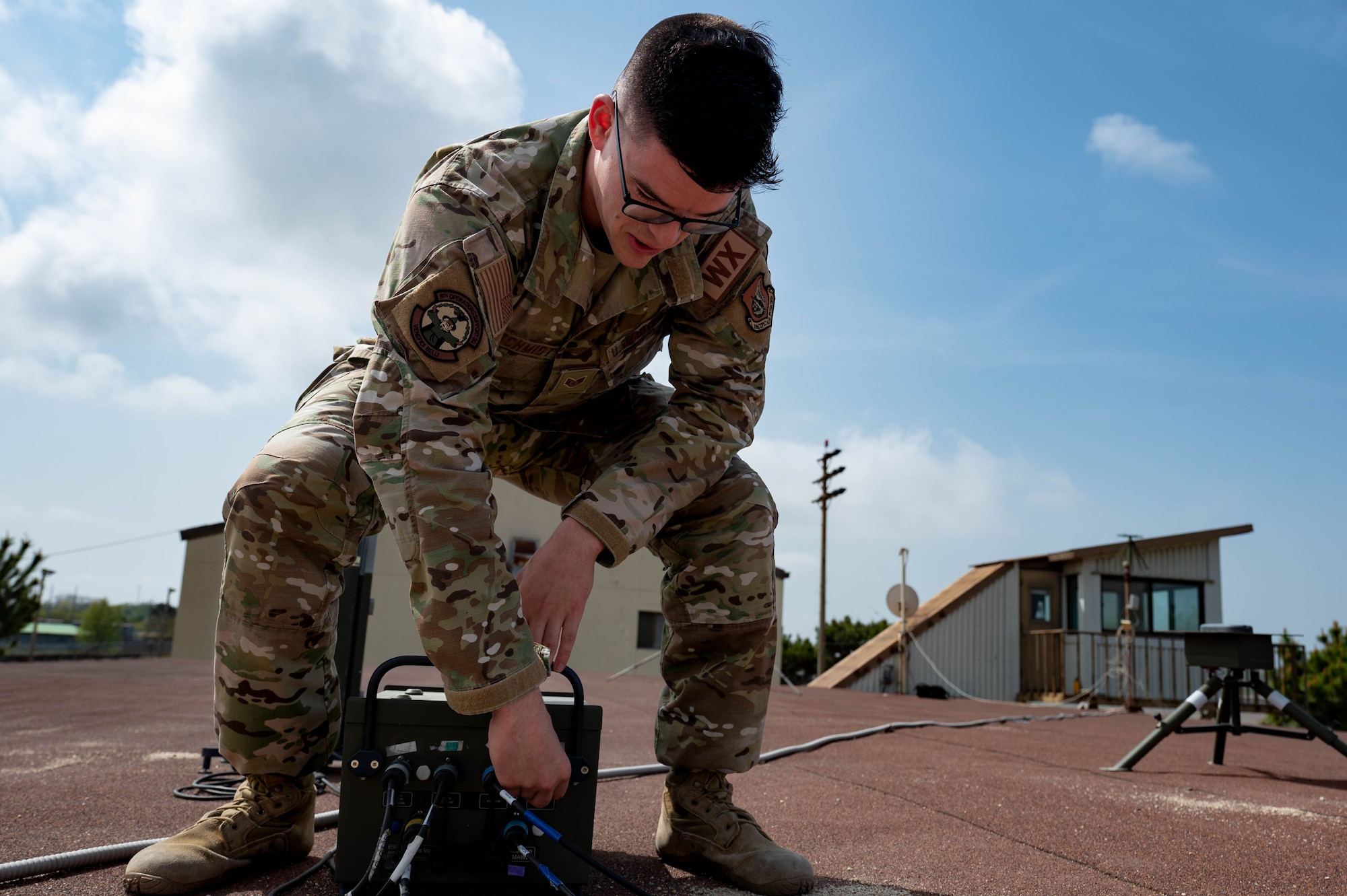 Staff Sgt. Kaleb Schmidt, 8th Operations Support Squadron weather craftsman, checks cables on weather forecast equipment at Kunsan Air Base, Republic of Korea, April 20, 2023.