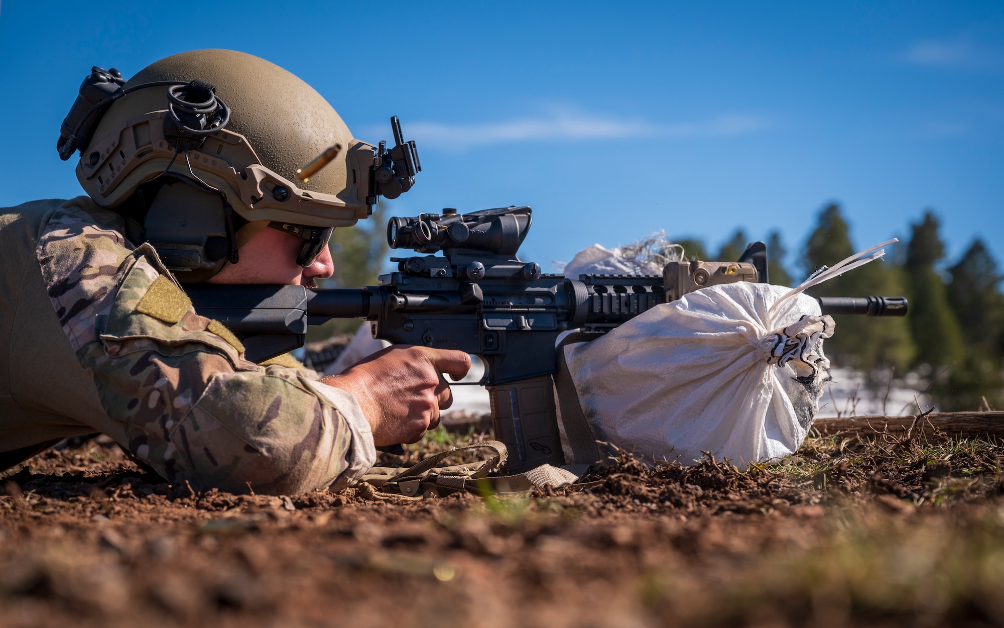 U.S. Air Force Senior Airman Seth Elroy, 56th Civil Engineer Squadron Explosive Ordnance Disposal flight technician, fires an M4 carbine assault rifle on a firing range at Camp Navajo, Arizona, April 10, 2023.