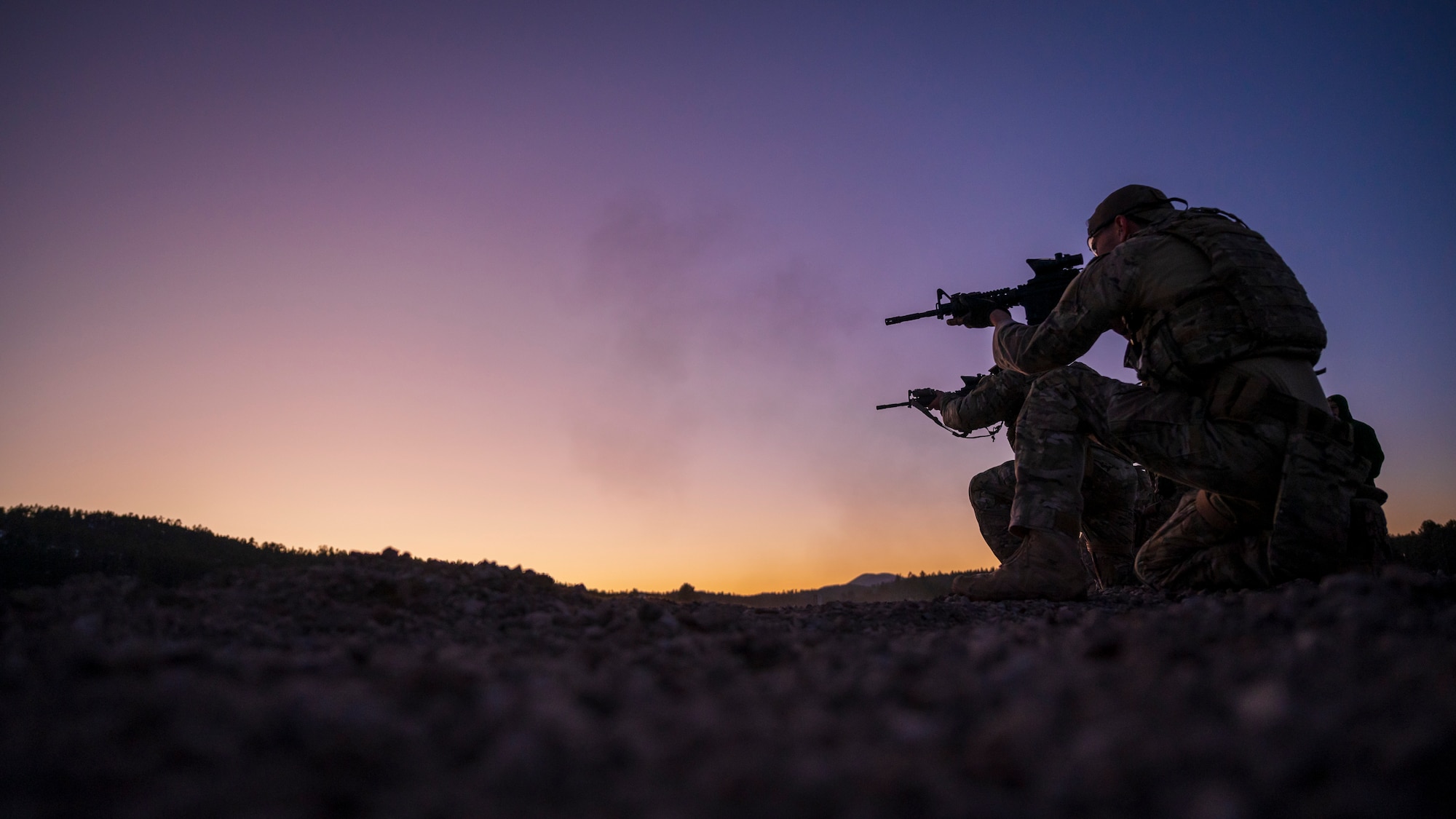 U.S. Air Force members assigned to the 56th Civil Engineer Squadron Explosive Ordnance Disposal flight fire M4 carbine assault rifles on a firing range at Camp Navajo, Arizona, April 10, 2023.