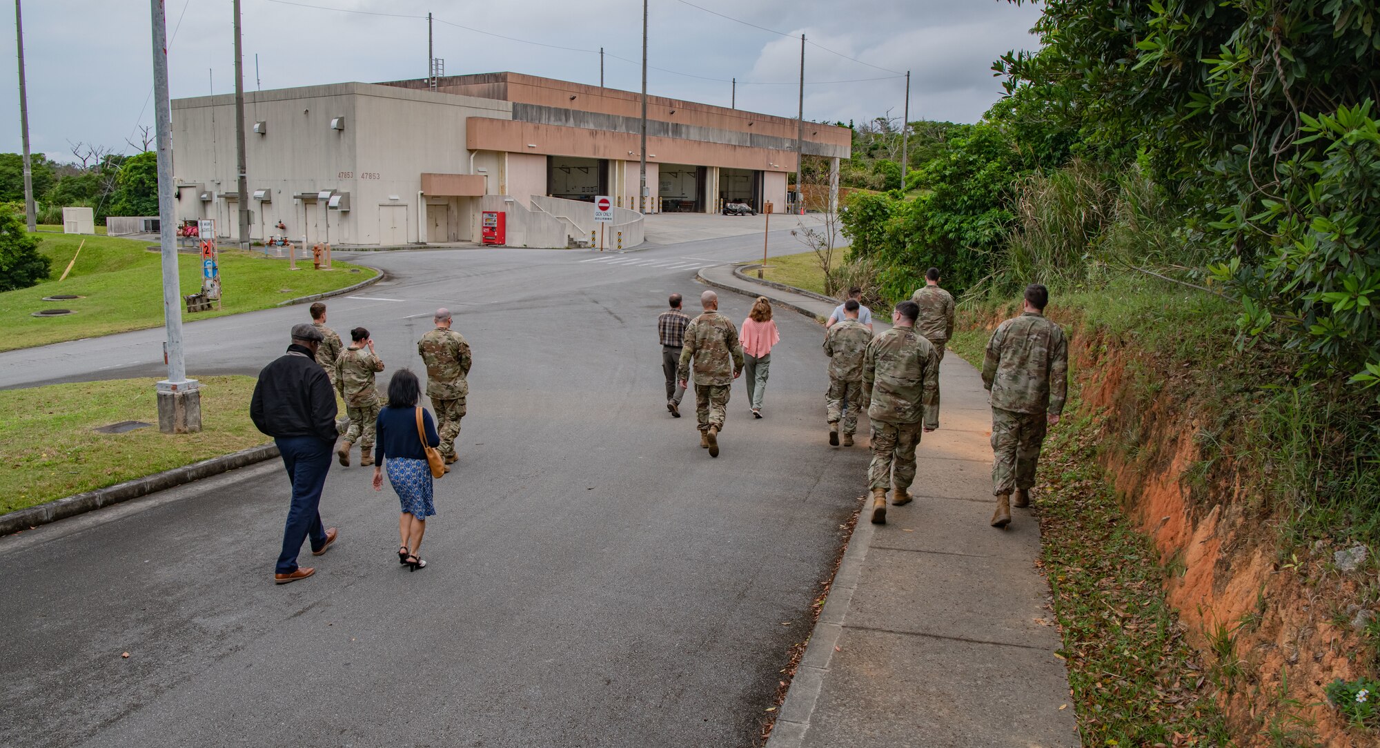 A high shot of a group of people walking toward a building.