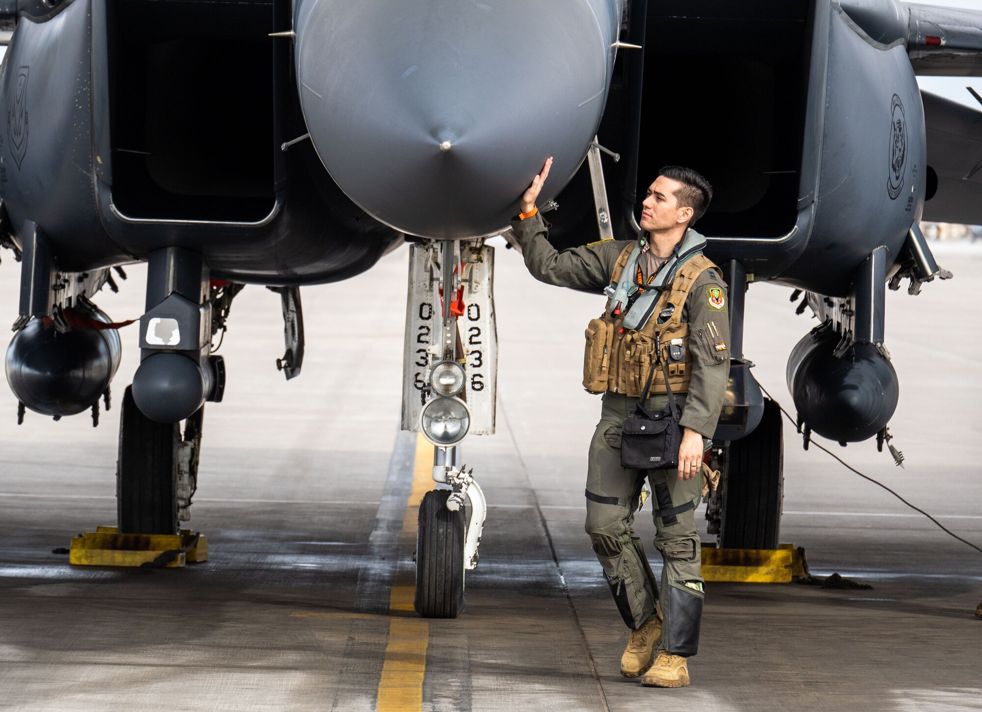A pilot performs a pre-flight check