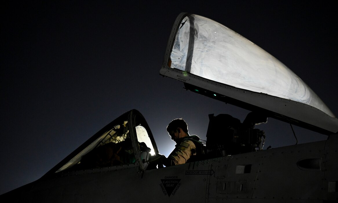 U.S. Air Force Maj. Daniel Harold, 75th Expeditionary Fighter Squadron pilot, conducts preflight checks in an A-10 Thunderbolt II prior to a combat sortie in the U.S. Central Command area of responsibility at Al Dhafra Air Base, United Arab Emirates, April 20, 2022. The deployment of A-10s in the region provides additional capability in the Middle East alongside fighter aircraft. This deployment ensures close air support specialists are able to build upon their skills in environments outside of the United States and ensure combat operations remain sharp across the force. (U.S. Air Force photo by Tech. Sgt. Alex Fox Echols III)