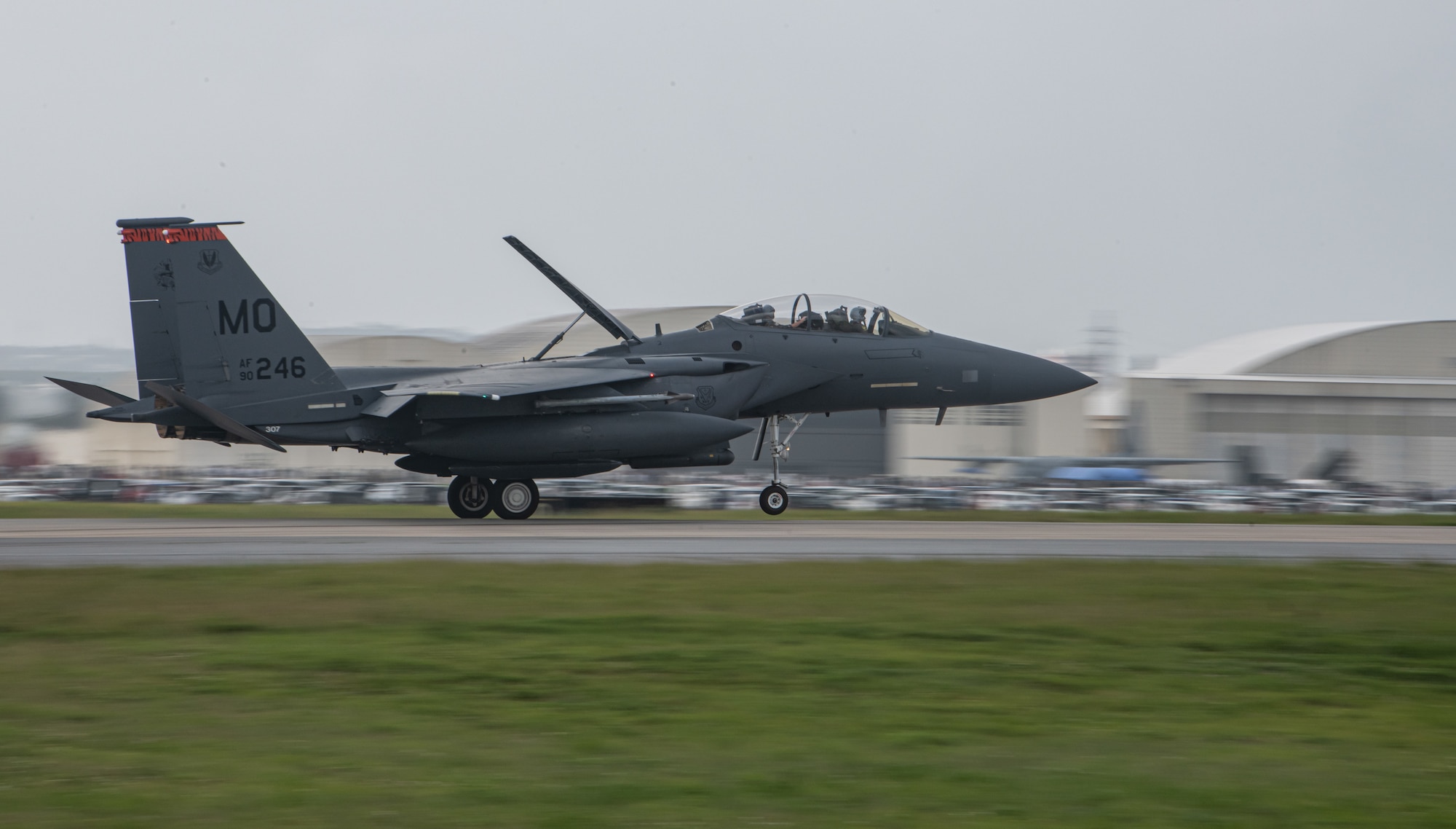 An F-15E lands on a runway.