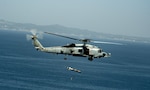 An MH-60R Seahawk attached to the “Saberhawks” of Helicopter Maritime Strike Squadron (HSM) 77 drops a torpedo during a torpedo exercise in Sagami Bay, Japan, April 13, 2023. The Saberhawks are forward-deployed to the 7th Fleet area of operation in support of a free and open Indo-pacific. (U.S. Navy photo by Mass Communication Specialist 2nd Class Askia Collins)