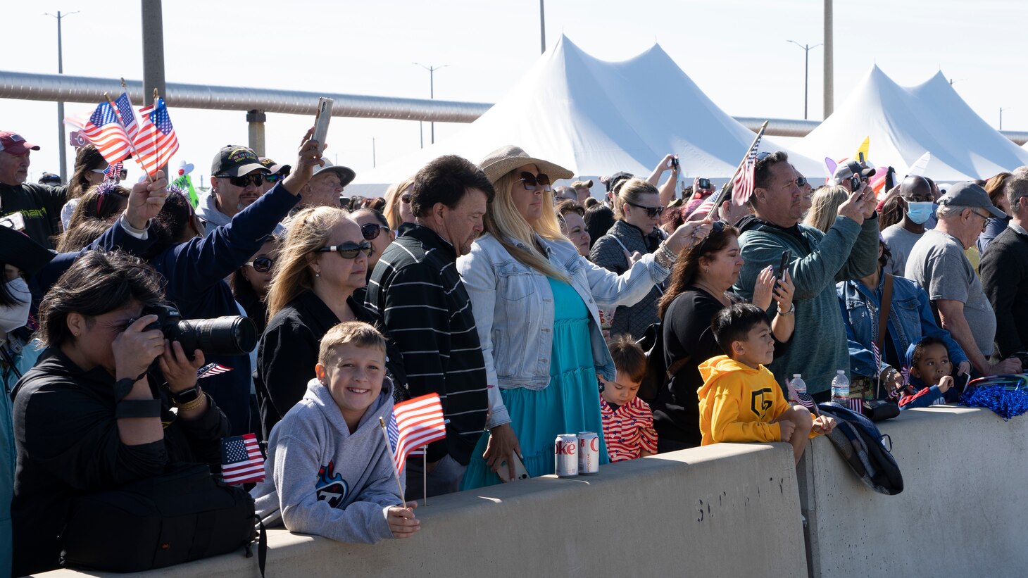 NORFOLK, Va. (April 23, 2023) Families watch the Nimitz-class aircraft carrier USS George H.W. Bush (CVN 77), along with the staff of carrier Strike Group (CSG) 10, as it returns to Naval Station Norfolk following an eight-month deployment, April 23, 2023. The George H.W. Bush CSG was deployed to the U.S. Naval Forces Europe area of operations, employed by U.S. Sixth Fleet to defend U.S., allied and partner interests. (U.S. Navy photo by Mass Communication Specialist 2nd Class Anderson W. Branch)