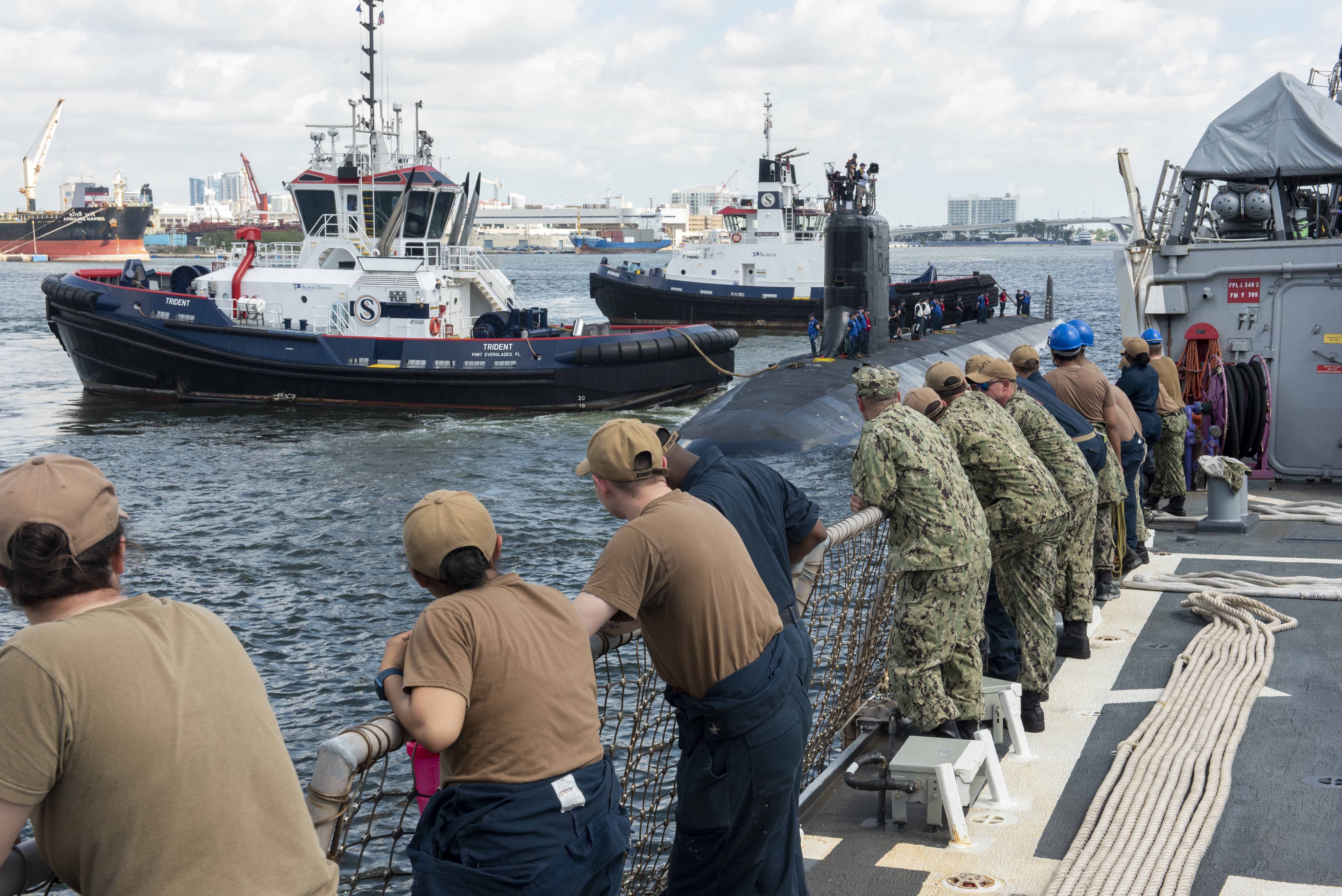 PORT EVERGLADES, Fla. (April 23, 2023) Sailors assigned to the Arleigh Burke-class guided-missile destroyer USS Cole (DDG 67) watch as the Virginia-class fast-attack submarine USS Indiana (SSN 789) arrives in port for Fleet Week Port Everglades in Fort Lauderdale, Fla. This year marks the 32nd Port Everglades Fleet Week. Fleet Week has been hosted by Broward Navy Days and other military support organizations since 1990, interrupted by COVID in 2020 and 2021. (U.S. Navy photo by Mass Communication Specialist 2nd Class Zachary D. Behrend)