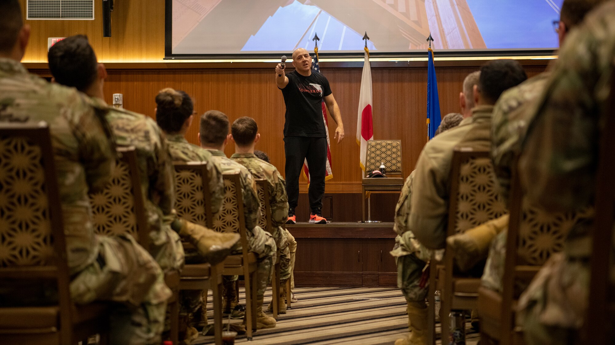 Kevin Hines, a motivational speaker and suicide attempt survivor, talks with Airmen regarding mental stress and suicidal thoughts at Kadena Air Base, Japan, April 19, 2023. Hines visited Kadena to speak with Airmen and shared his experience in surviving a suicide attempt. (U.S. Air Force photo by Airman 1st Class Edward Yankus)