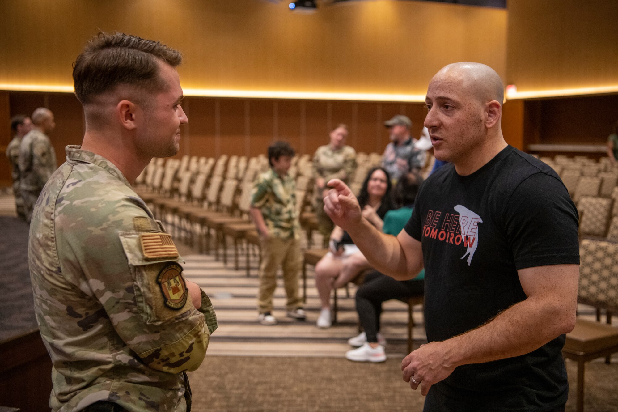 Kevin Hines, a motivational speaker and suicide attempt survivor, right, talks with Airman 1st Class Joseph Marshall, 18th Civil Engineer Squadron water and fuels systems apprentice, at Kadena Air Base, Japan, April 19, 2023. Kadena Airmen shared their personal stories with Hines after the seminar. (U.S. Air Force photo by Airman 1st Class Edward Yankus)