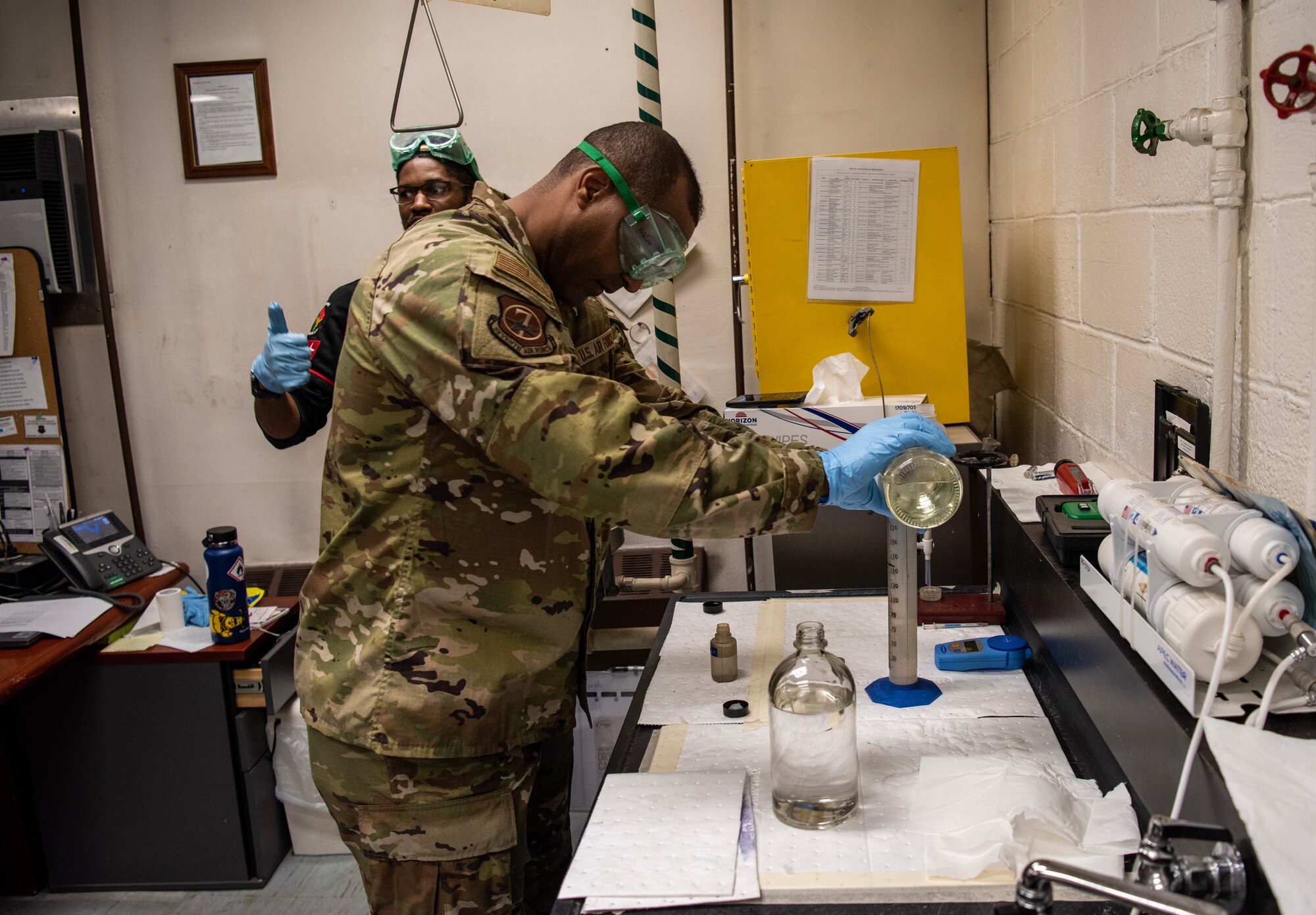 U.S. Air Force Chief Master Sgt. Alvin Dyer, 7th Air Force command chief, performs a fuel sample analysis during a visit to the 51st Logistics Readiness Squadron fuels flight, March 21, 2023, at Osan Air Base