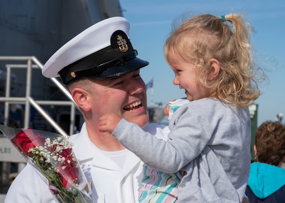 NORFOLK, Va. – Chief Fire Controlman Blake Kloepping, a native of Arlington, Texas and assigned to the Ticonderoga-class guided-missile cruiser USS Leyte Gulf (CG 55), embraces his daughter on the pier at Naval Station Norfolk following an eight-month deployment with Carrier Strike Group (CSG) 10, April 23, 2023. The George H.W. Bush CSG was deployed to the U.S. Naval Forces Europe area of operations, employed by U.S. Sixth Fleet to defend U.S., allied and partner interests. (U.S. Navy photo by Mass Communication Specialist 1st Class Kris R. Lindstrom)