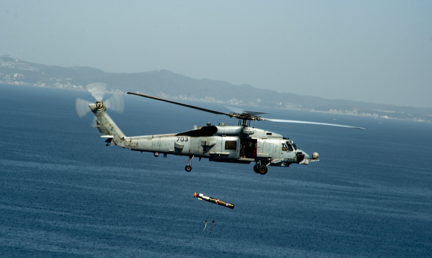 An MH-60R Seahawk attached to the “Saberhawks” of Helicopter Maritime Strike Squadron (HSM) 77 drops a torpedo during a torpedo exercise in Sagami Bay, Japan, April 13, 2023. The Saberhawks are forward-deployed to the 7th Fleet area of operation in support of a free and open Indo-pacific. (U.S. Navy photo by Mass Communication Specialist 2nd Class Askia Collins)