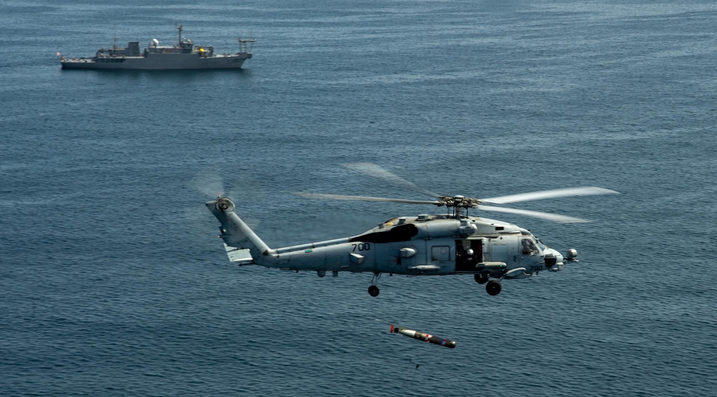 An MH-60R Seahawk attached to the “Saberhawks” of Helicopter Maritime Strike Squadron (HSM) 77 drops a torpedo alongside the Futami-class research ship JS Wakasa (AGS-5104) during a torpedo exercise in Sagami Bay, Japan, April 13, 2023. The Saberhawks are forward-deployed to the 7th Fleet area of operation in support of a free and open Indo-pacific. (U.S. Navy photo by Mass Communication Specialist 2nd Class Askia Collins)