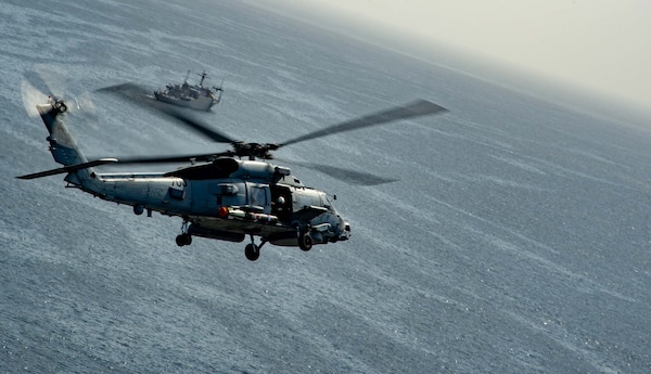 An MH-60R Seahawk attached to the “Saberhawks” of Helicopter Maritime Strike Squadron (HSM) 77 flies alongside the Futami-class research ship JS Wakasa (AGS-5104) in Sagami Bay, Japan, April 13, 2023. The Saberhawks are forward-deployed to the 7th Fleet area of operation in support of a free and open Indo-pacific. (U.S. Navy photo by Mass Communication Specialist 2nd Class Askia Collins)