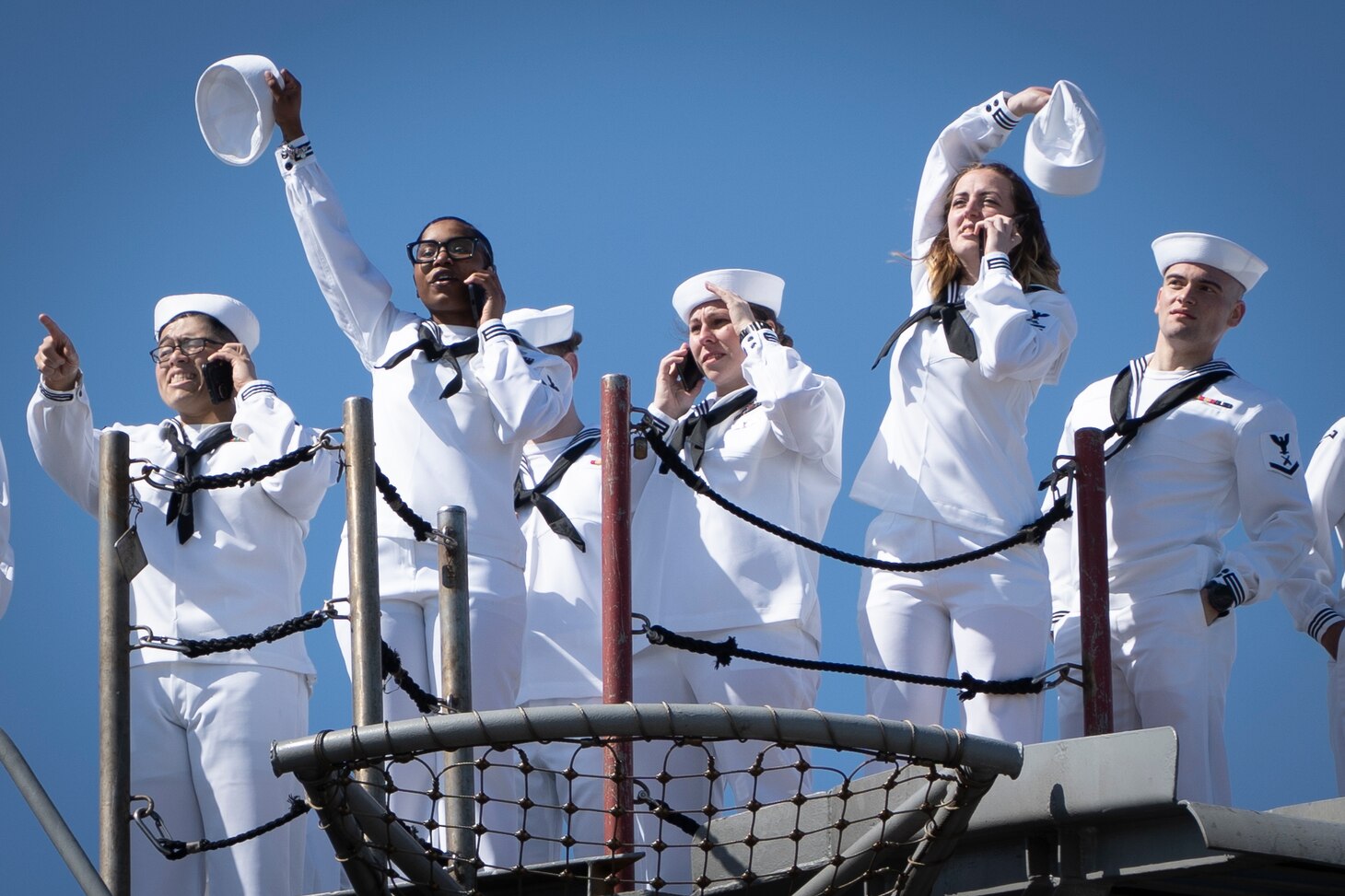 NORFOLK, Va. (April 23, 2023) Sailors assigned to the Nimitz-class aircraft carrier USS George H.W. Bush (CVN 77), along with the staff of carrier Strike Group (CSG) 10, wave to family members as the ship returns to Naval Station Norfolk following an eight-month deployment, April 23, 2023. The George H.W. Bush CSG was deployed to the U.S. Naval Forces Europe area of operations, employed by U.S. Sixth Fleet to defend U.S., allied and partner interests. (U.S. Navy photo by Mass Communication Specialist 2nd Class Anderson W. Branch)