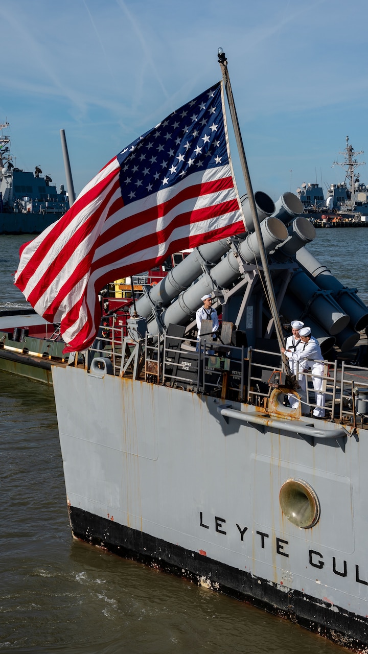 NORFOLK, Va. – Sailors aboard the Ticonderoga-class guided-missile cruiser USS Leyte Gulf (CG 55) shift colors as they are mooring pier side at Naval Station Norfolk following an eight-month deployment with Carrier Strike Group (CSG) 10, April 23, 2023. The George H.W. Bush CSG was deployed to the U.S. Naval Forces Europe area of operations, employed by U.S. Sixth Fleet to defend U.S., allied and partner interests. (U.S. Navy photo by Mass Communication Specialist 1st Class Kris R. Lindstrom)
