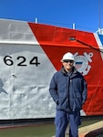 Chief Petty Officer Llamas shows off his deck department’s hard work reflected in the freshly painted hull of the Coast Guard cutter Dauntless in New York City. Llamas is the deck department chief for the 210-foot medium endurance cutter homeported in Pensacola, Florida.