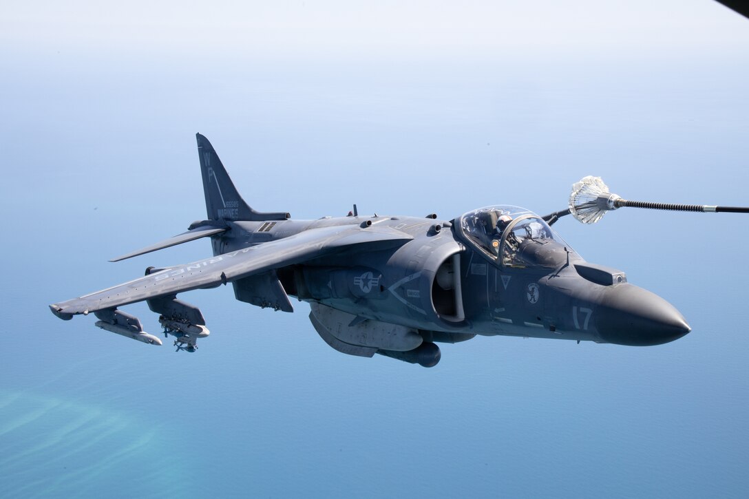 U.S. Marine Corps Capt. Nicholas C. Arias, an AV-8B Harrier II pilot with Marine Attack Squadron (VMA) 223, flies behind a KC-130J Hercules assigned to Marine Aerial Refueler Transport Squadron (VMGR) 252 above Marine Corps Air Station Cherry Point, North Carolina, April 18, 2023. VMGR-252 conducted fixed-wing aerial-refueling training with VMA-223 to increase proficiency in aerial refueling. VMGR-252 and VMA-223 are subordinate units of 2nd Marine Aircraft Wing, the aviation combat element of II Marine Expeditionary Force. (U.S. Marine Corps photo by Staff Sgt. Theodore Bergan)