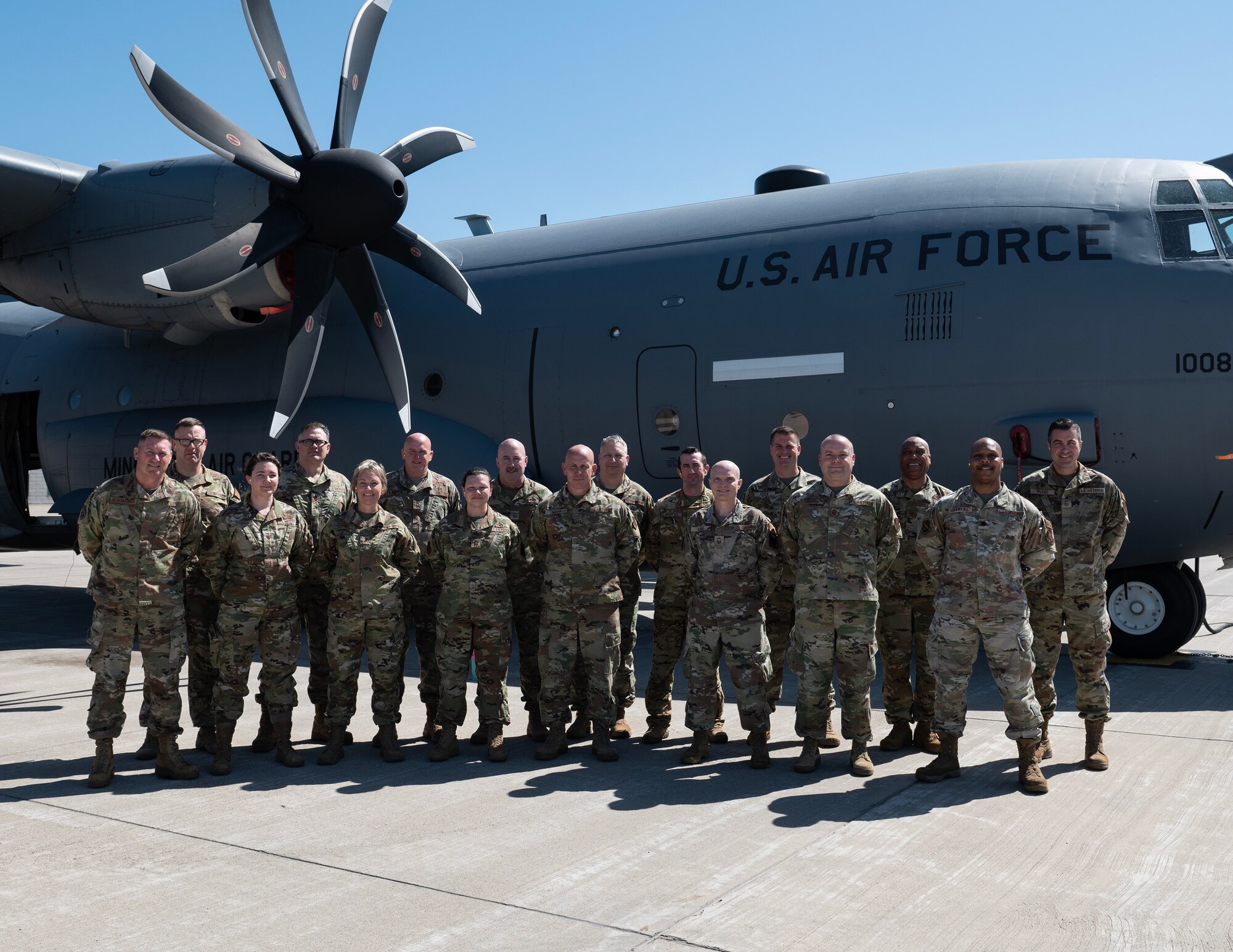 U.S. Air Force Airmen from the Production Assessment Team and 133rd Maintenance Group leadership pose for a group photo in St. Paul, April 11, 2023.