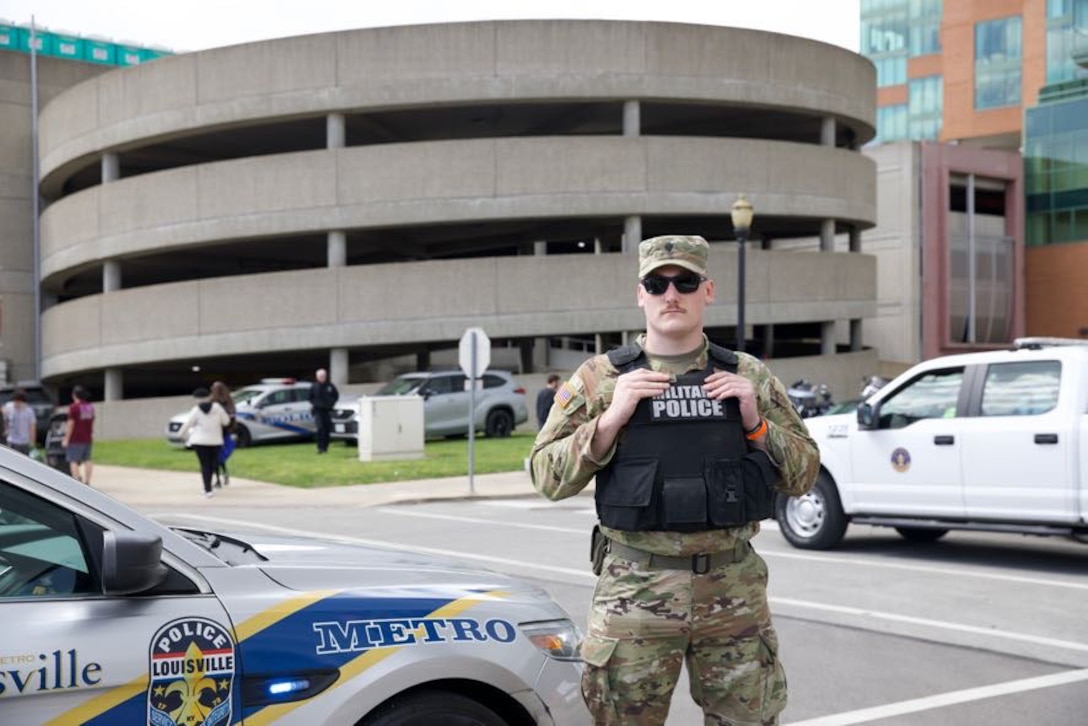 U.S. Army Spc. Isiah Baker, of the 617th Military Police Company, provides security at Thunder Over Louisville in Louisville, Kentucky on April 22, 2023 in conjunction with the Louisville Metro Police Department. Thunder Over Louisville kicks off the two-week celebration leading up to the Kentucky Derby. (U.S. Army National Guard photo by Pfc. Georgia Napier.)