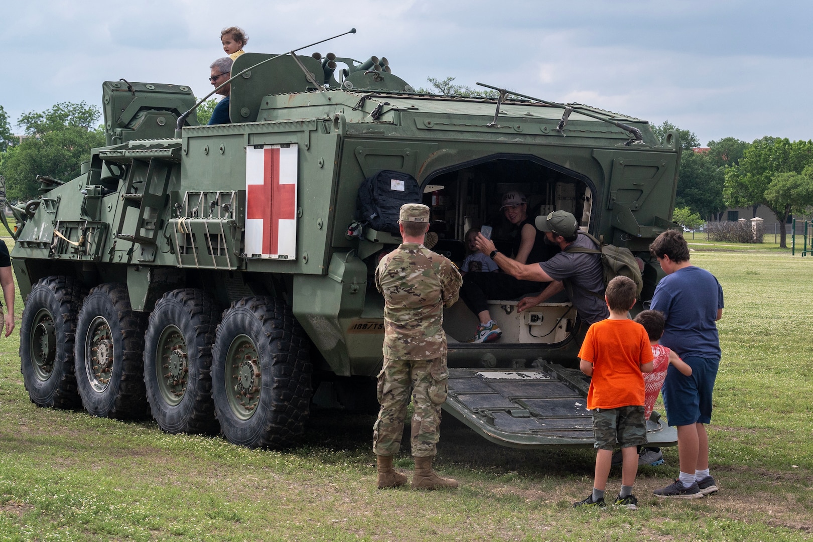 People in military vehicle