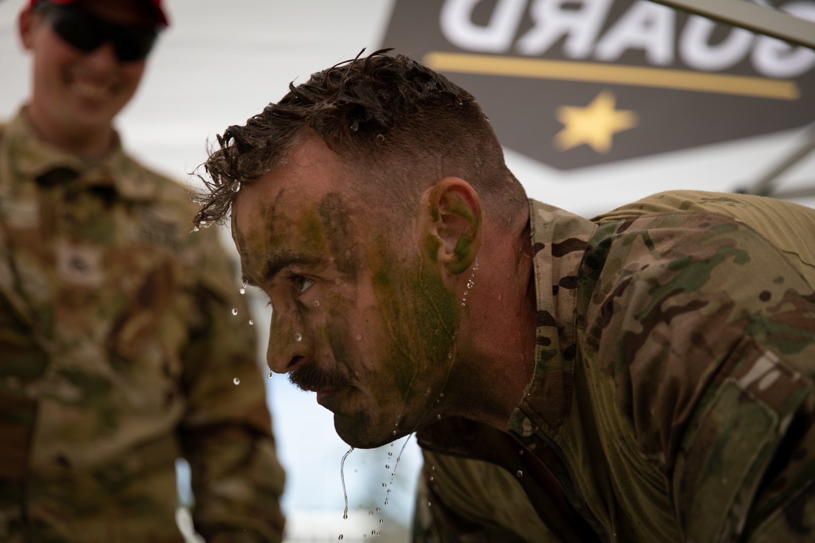 U.S. Army Sgt. Nicolas White, an indirect fire infantryman representing the Georgia Army National Guard, splashes water on his face after completing the confidence course during the Region III National Guard Best Warrior Competition at Fort Stewart, Ga., April 17, 2023. The competition tested the adaptiveness and lethality of our forces.