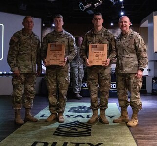U.S. Army Spc. Jackson Jacobs, left holding plaque, an artillery forward observer representing the Tennessee Army National Guard, and Sgt. Quentin Holden, right holding plaque, a UH-60 helicopter crew chief representing the Georgia Army National Guard, are nominated the Best Warrior and Noncommissioned Officer of the 2023 Region III Army National Guard Best Warrior Competition at Fort Stewart, Georgia, April 21, 2023. They will go on to compete at the 2023 National Army National Guard Best Warrior Competition against the winners in the four other regions at Joint Base Elmendorf-Richardson, Alaska, July 6-15, 2023.