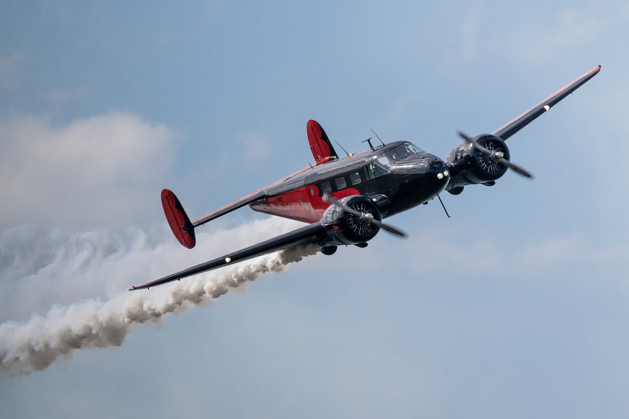 A Twin Beech aircraft from Younkin Airshows performs an aerial demonstration along the banks of the Ohio River in downtown Louisville, Ky., April 22, 2023, as part of the annual Thunder Over Louisville air show. This year’s event featured more than 20 military and civilian planes, from the latest-generation fighter jets to historic warbirds. (U.S. Air National Guard photo by Dale Greer)