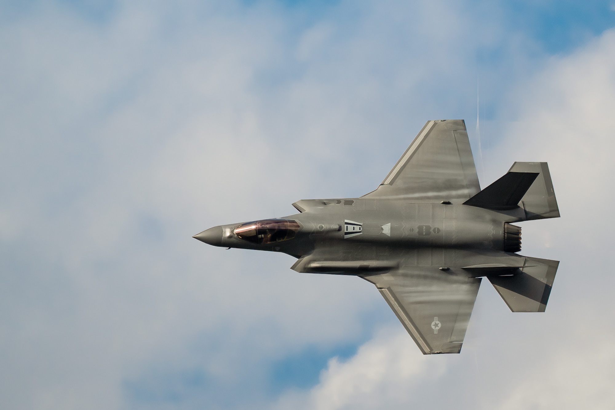 An aircraft from the U.S. Air Force F-35A Lightning II Demo Team, piloted by Maj. Kristin Wolfe, performs an aerial demonstration along the banks of the Ohio River in downtown Louisville, Ky., April 22, 2023, as part of the annual Thunder Over Louisville air show. This year’s event featured more than 20 military and civilian planes, including a C-130J Super Hercules from the Kentucky Air National Guard, which served as the base of operations for military aircraft participating in the show. (U.S. Air National Guard photo by Dale Greer)