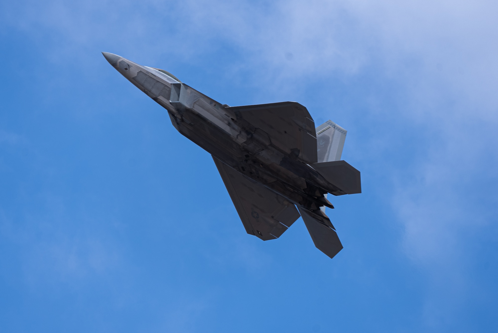 The F-22 Raptor demo team performs during the 2023 Dyess Big Country Air Fest on Dyess Air Force Base, Texas, April 22, 2023. More than 30,000 event goers attended the one-day event highlighting the best of America’s only Lift and Strike base, Air Force heritage and Dyess community partners. The air show featured the F-22 Raptor demo team, U.S. Air Force Academy Wings of Blue, U.S. Army Golden Knights, WW II heritage flight and B-1B Lancer and C-130J Super Hercules fly overs. (U.S. Air Force photo by Airman 1st Class James Hall)