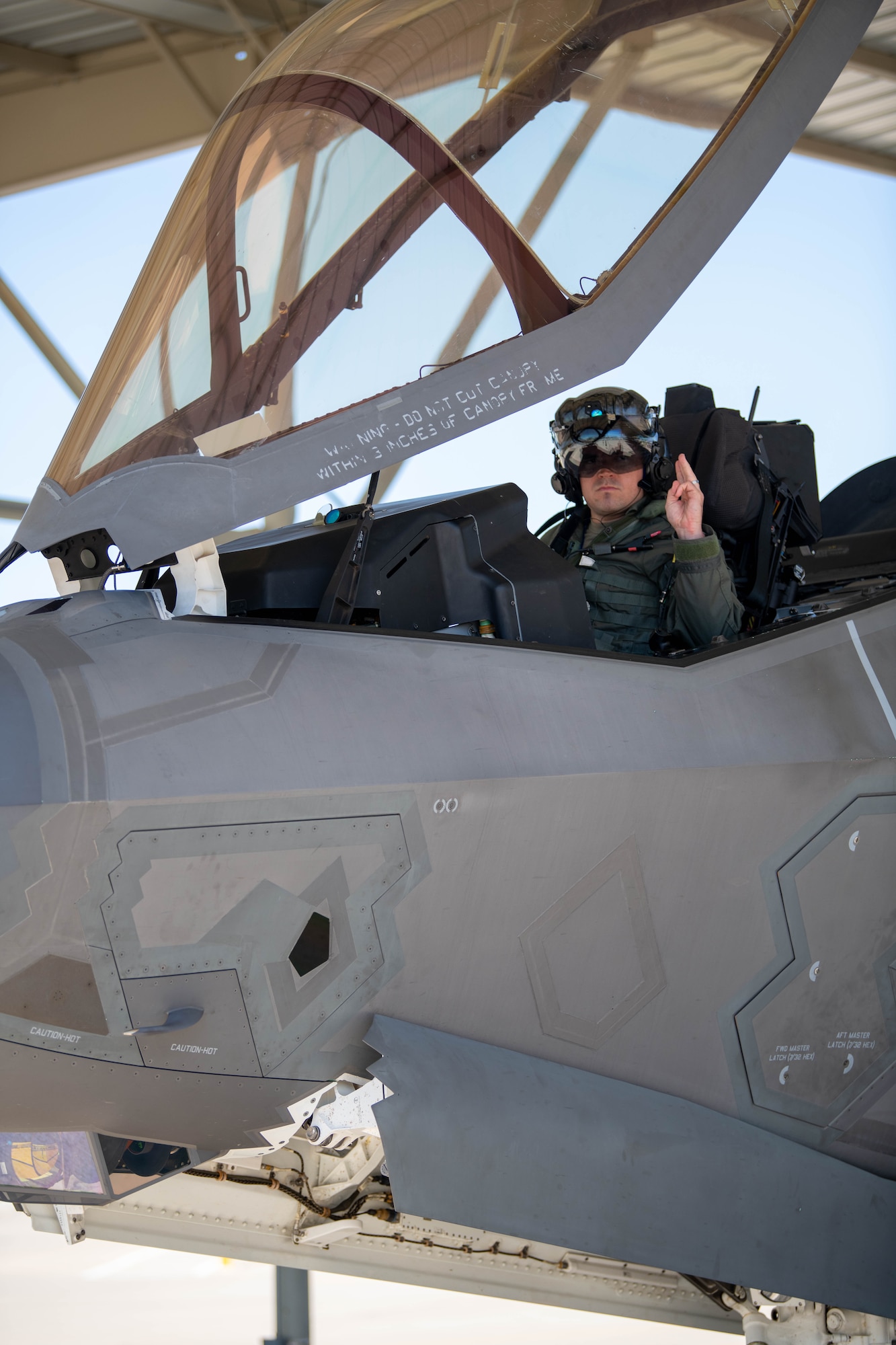 U.S. Air Force Maj. Christopher Jeffers, 62nd Fighter Squadron student pilot, signals to his crew chief, April 17th, 2023, at Luke Air Force Base, Arizona.