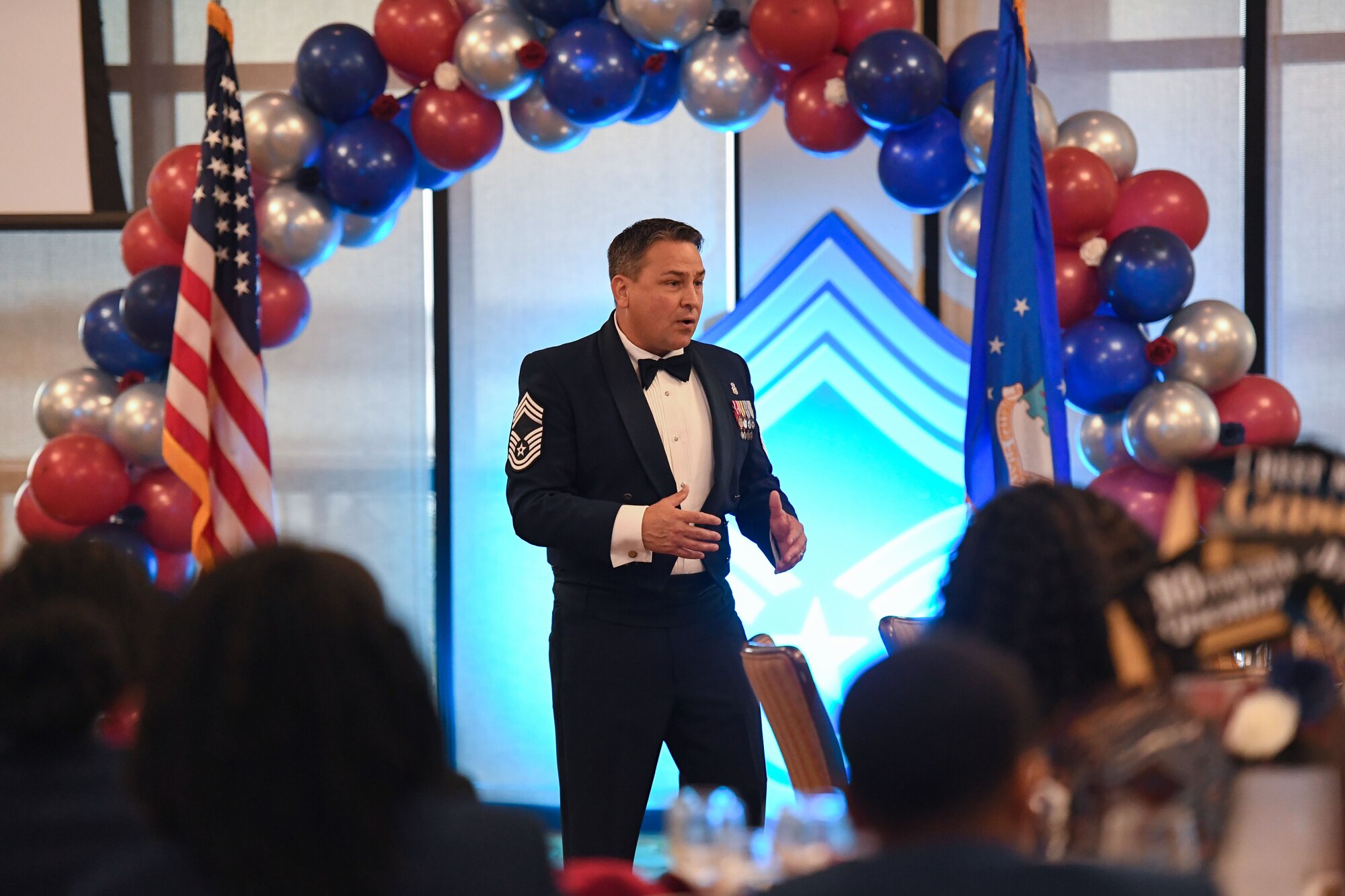U.S. Air Force Retired Chief Master Sgt. Chad Balance delivers remarks during the Chief Master Sergeant Recognition Ceremony inside the Bay Breeze Event Center at Keesler Air Force Base, Mississippi, April 20, 2023.