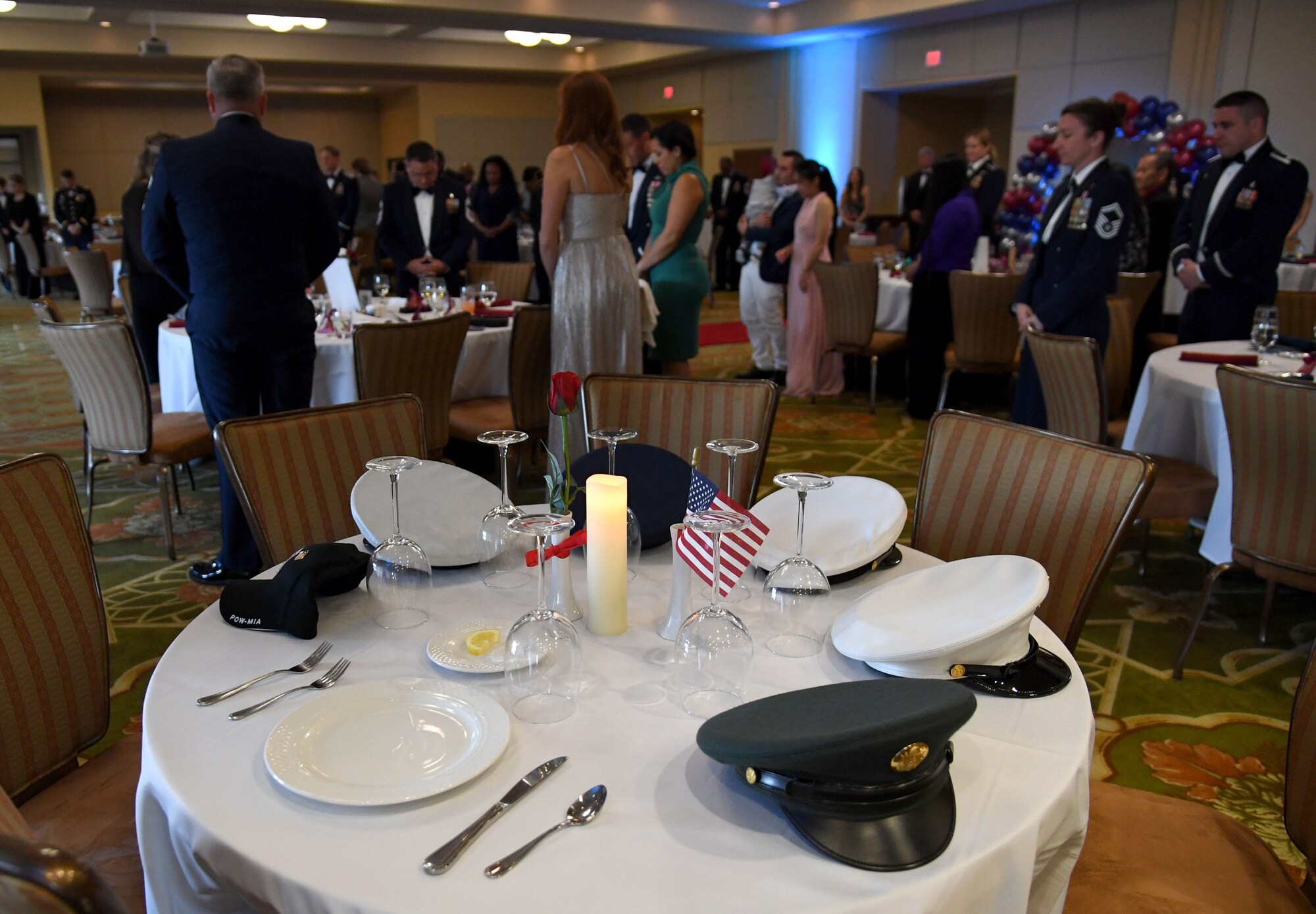 A POW/MIA table is on display while Keesler personnel observe a moment of silence during the Chief Master Sergeant Recognition Ceremony inside the Bay Breeze Event Center at Keesler Air Force Base, Mississippi, April 20, 2023.