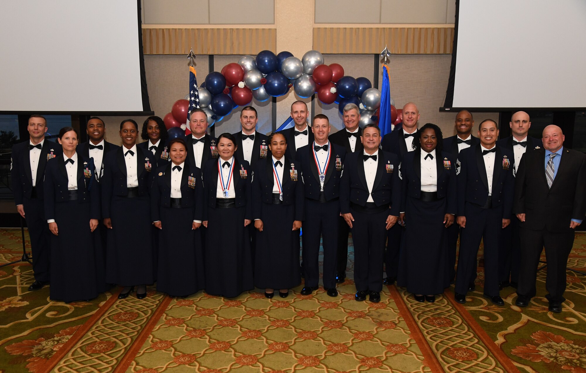 Recently inducted and current Keesler chief master sergeants pose for a photo during the Chief Master Sergeant Recognition Ceremony inside the Bay Breeze Event Center at Keesler Air Force Base, Mississippi, April 20, 2023.