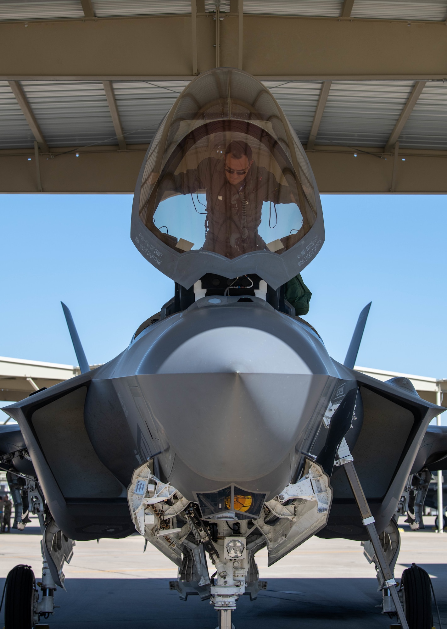 U.S. Air Force Maj. Christopher Jeffers, 62nd Fighter Squadron student pilot, climbs into an F-35A Lightning II fighter jet, April 17th, 2023, at Luke Air Force Base, Arizona.
