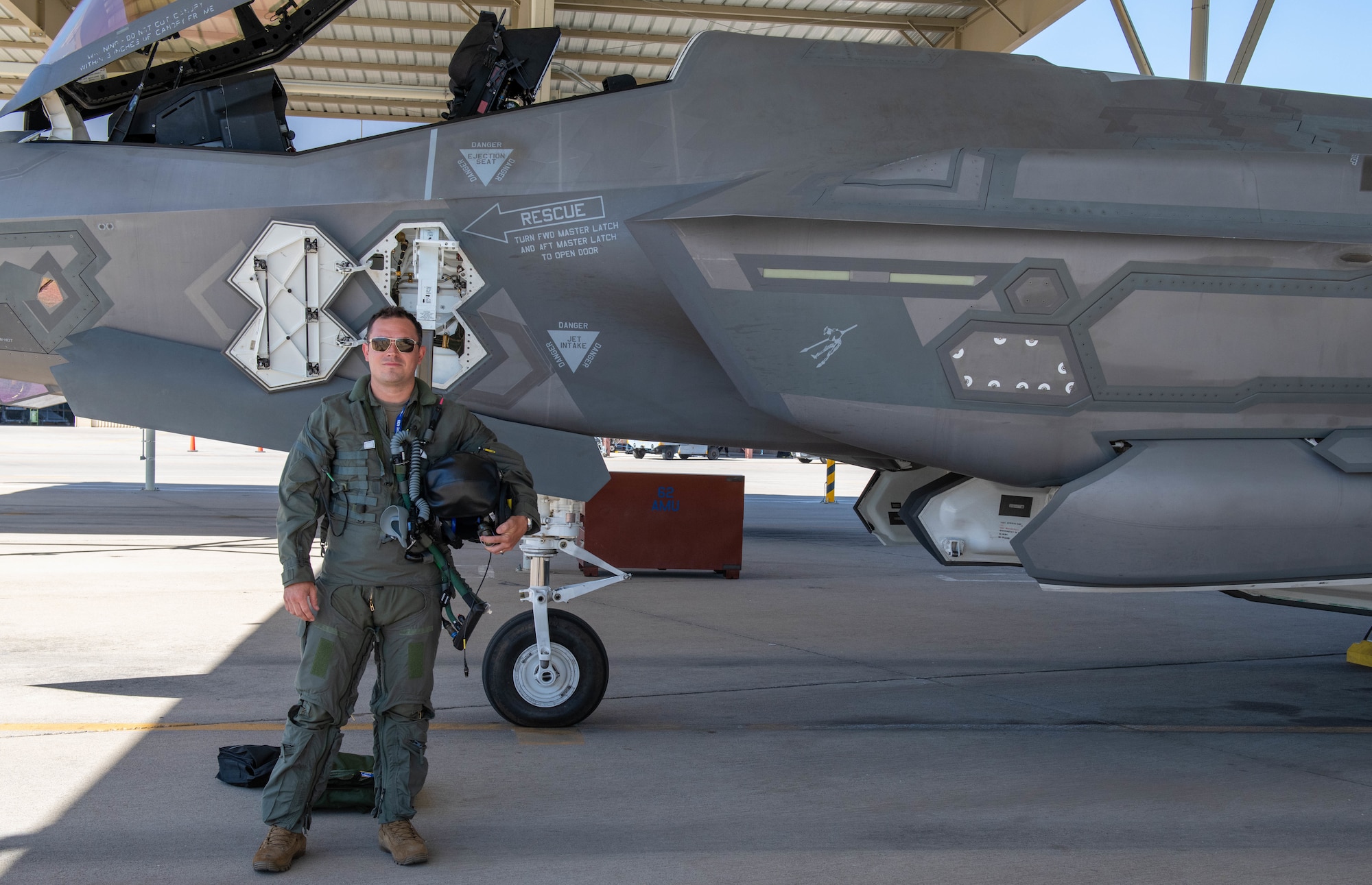 U.S. Air Force Maj. Christopher Jeffers, 62nd Fighter Squadron student pilot, poses for a photograph in front of an F-35A Lightning II fighter jet, April 17th, 2023, at Luke Air Force Base, Arizona.