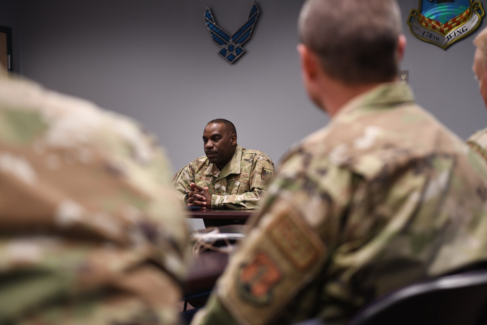 U.S. Air Force Chief Master Sgt. Maurice Williams, command chief, Air National Guard speaks to first sergeants of the 178th Wing, Ohio National Guard in Springfield, Ohio, Oct. 15. 2022. Williams created an open dialogue to discuss the new ways of cultivating success during one's time as a first sergeant in the Air National Guard. (U.S. Air National Guard photo by Senior Airman Jillian Maynus).