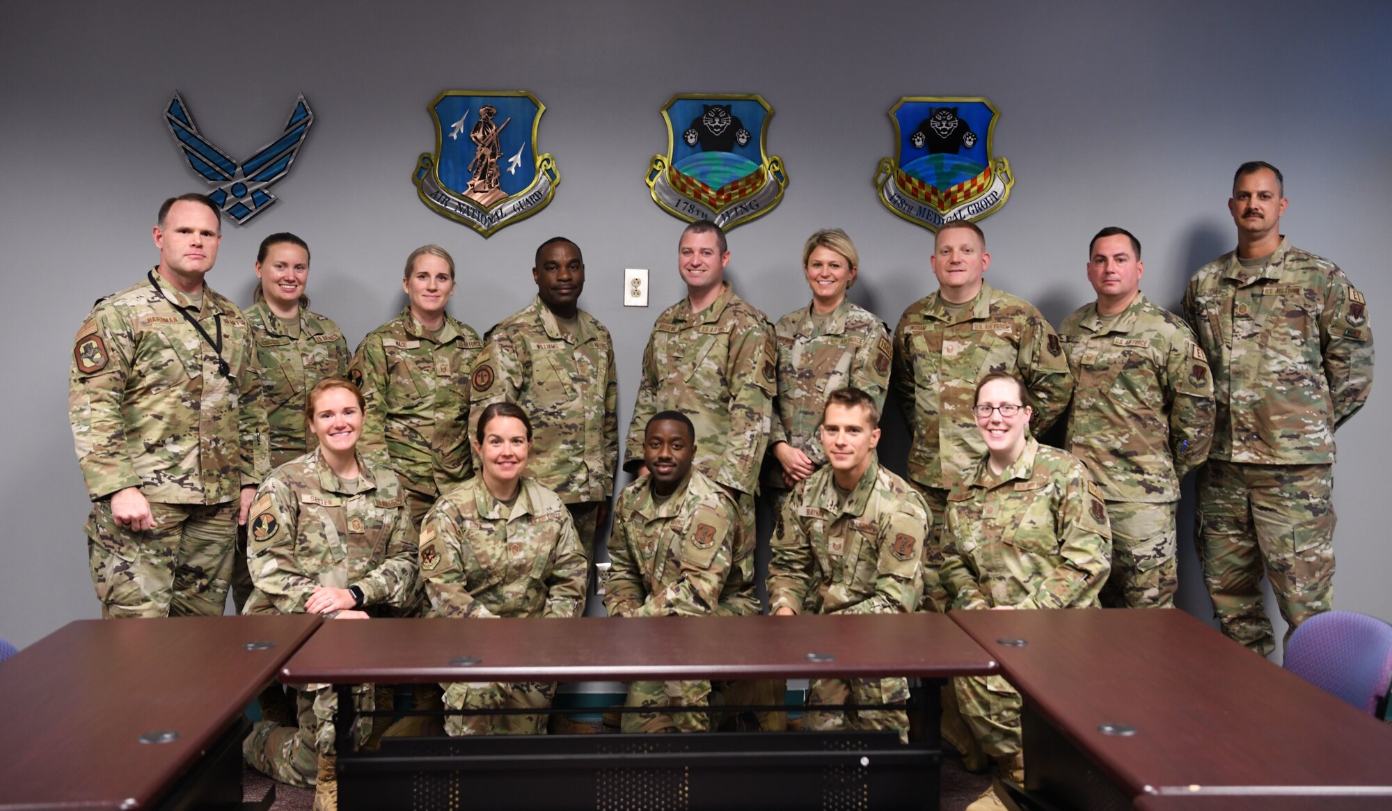 U.S. Air Force Chief Master Sgt. Maurice Williams, command chief, back center, Air National Guard, poses for a group photo with the first sergeants of the 178th Wing, Ohio  National Guard in Springfield, Ohio, Oct. 15, 2022. The first sergeants were given the opportunity to receive guidance on challenges and ask questions to further the success of the airman they mentor. (U.S. Air National Guard photo by Senior Airman Jillian Maynus).