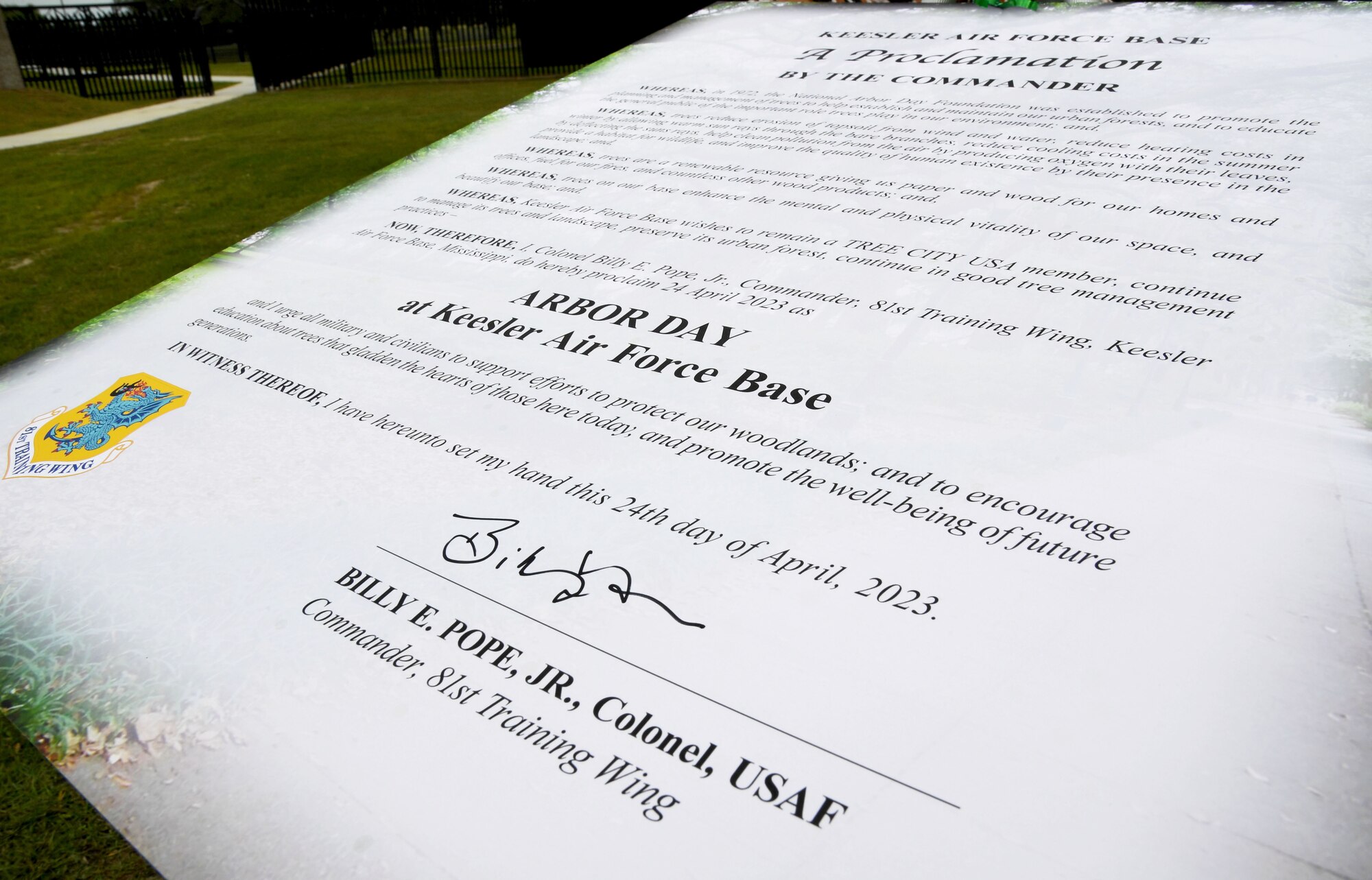 The Arbor Day proclamation is on display during a tree planting ceremony near the Division Street Gate at Keesler Air Force Base, Mississippi, April 24, 2023.