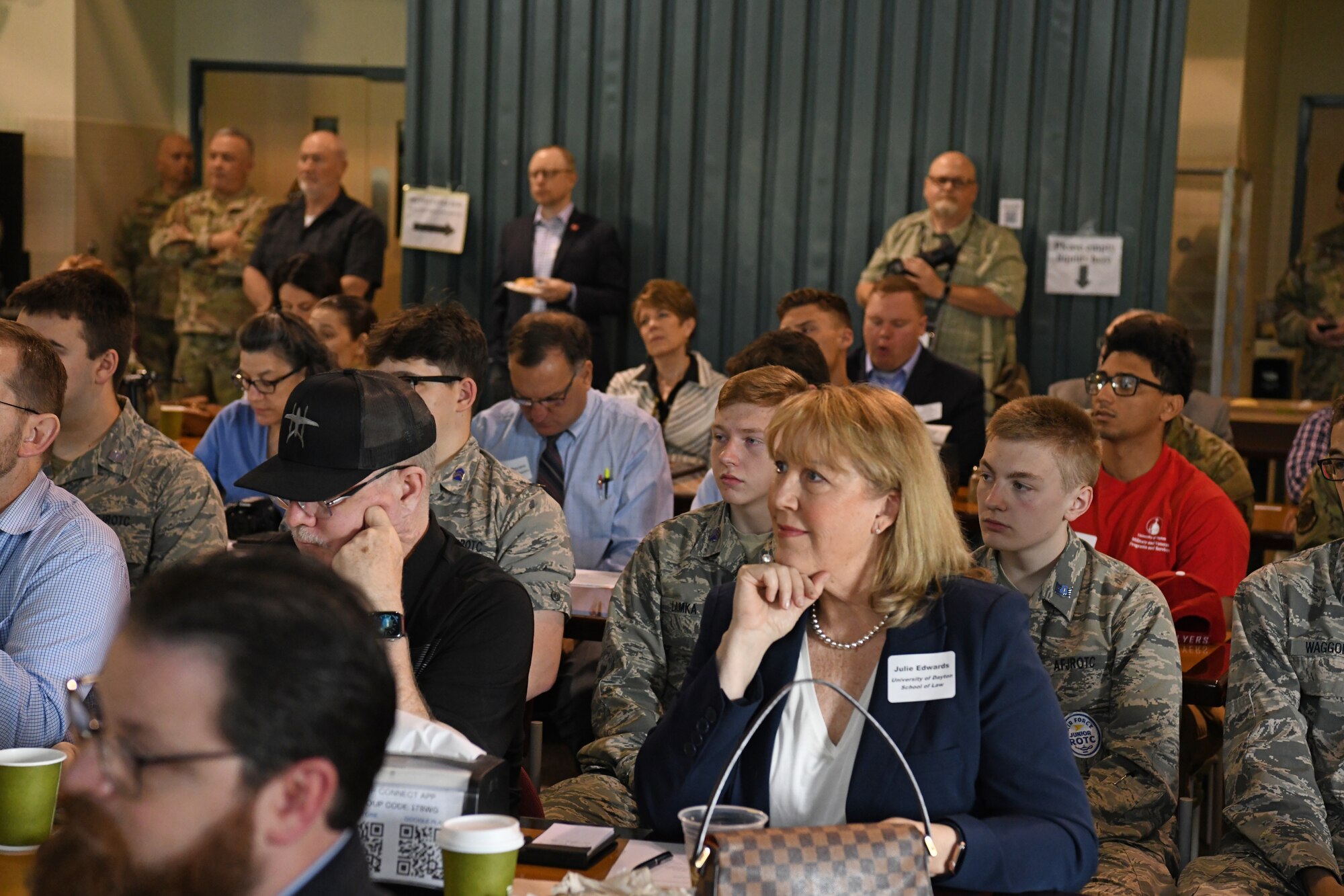 Community members sit in the audience during the Community Day informational briefings at Ohio Air National Guard’s 178th Wing, April 20, 2023 in Springfield, Ohio. The event consisted of a briefing on the wing's capabilities and a base tour. (U.S. Air National Guard photo by Senior Airman Jill Maynus)