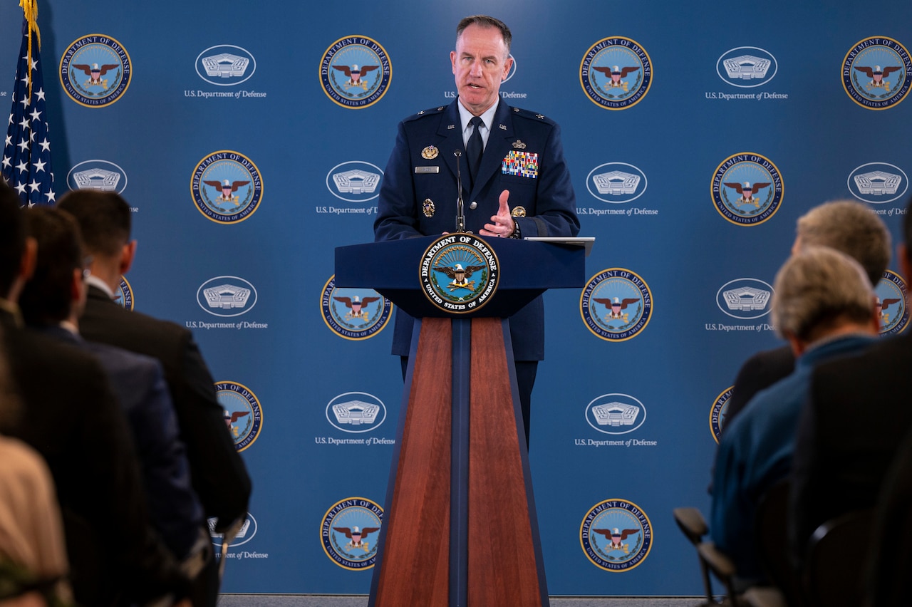 A man speaks from a podium.